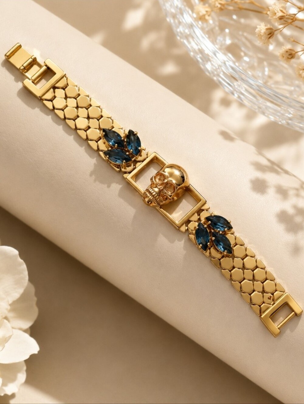 Make a bold statement with this eye-catching gold-tone bracelet featuring a uniq